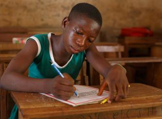 Ophelia 14 draws a building in her classroom.
